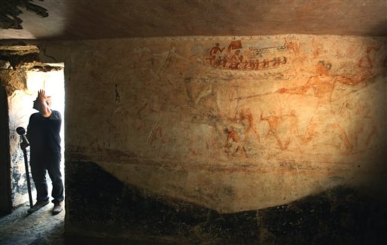 A painted mural decorates the inside of the newly discovered tomb that belonged to Rudj-ka, a priest who headed the mortuary cult of the pharaoh Khafre, at the site of the Giza Pyramids in Cairo, Egypt Tuesday, Oct. 19, 2010. Egypt's antiquities authority says archaeologists have unearthed a nearly 4,500-year-old tomb of a pharaonic priest close to the Giza Pyramids. (AP Photo/Nasser Nasser)
